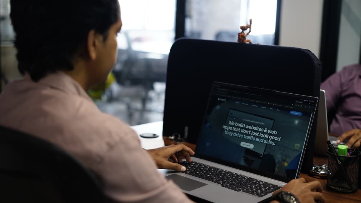 A Cubiccode developer reviewing a live website build